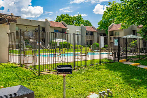 Fence surrounding pool at Eagle Point Apartments, New Mexico
