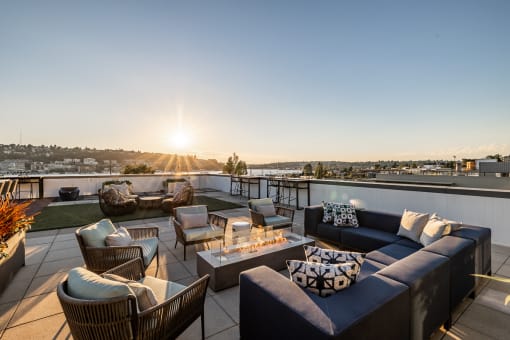 Equinox Rooftop Terrence seating area with firepit  at Equinox Apartments, Seattle, WA, 98102