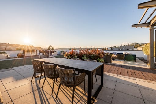 Equinox Rooftop Terrence dining table  at Equinox Apartments, Seattle, WA