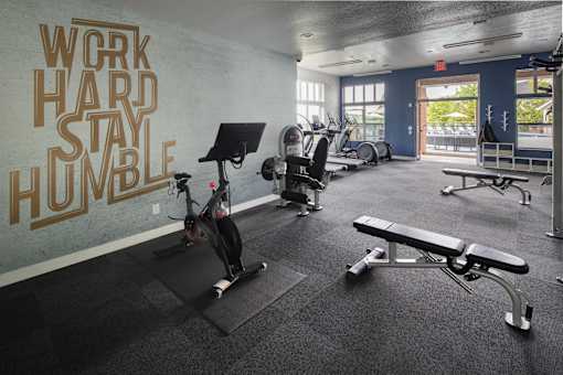 A gym with a wall that says