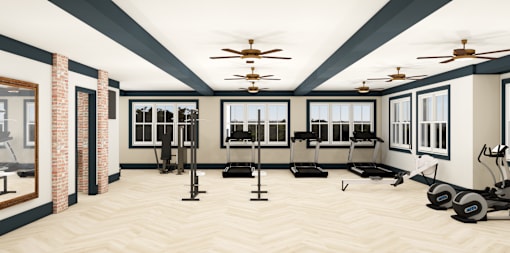 A spacious gym with treadmills, elliptical machines, and a fan.