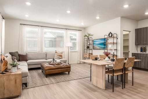 a living room and dining room with a couch and a table