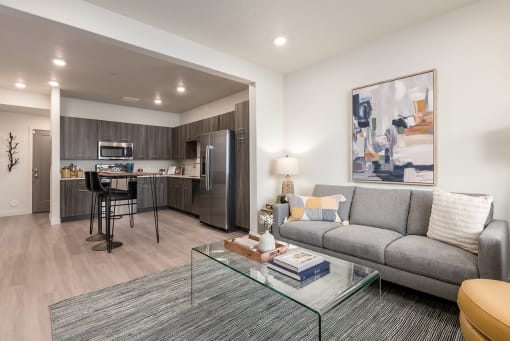 a living room with a couch and a glass table
