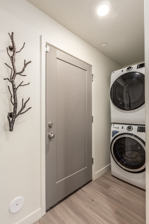 a small laundry room with a washing machine and a dryer