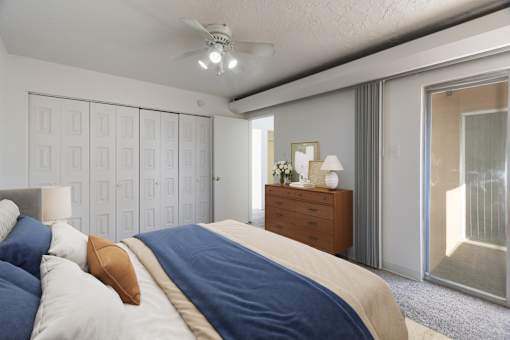 A bedroom with a bed, dresser, and mirror.