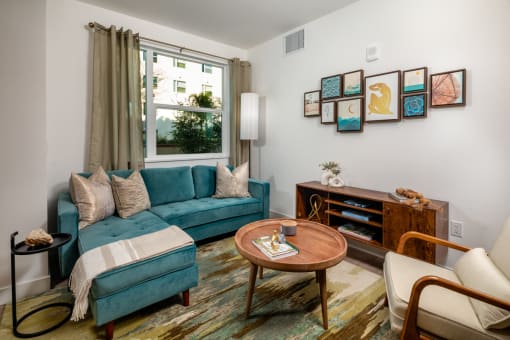 Blue couch, table at Aston at Gateway Apartments, California, 91731