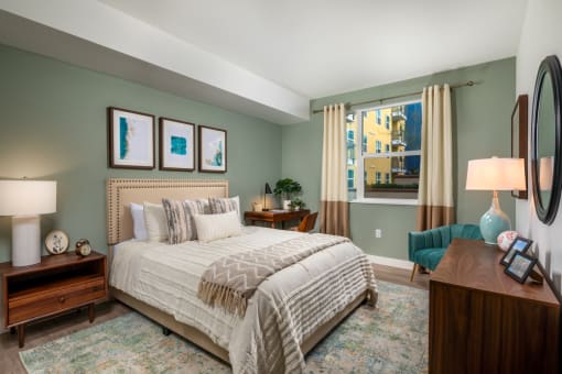 Bedroom with cozy bed at Aston at Gateway Apartments, El Monte, 91731
