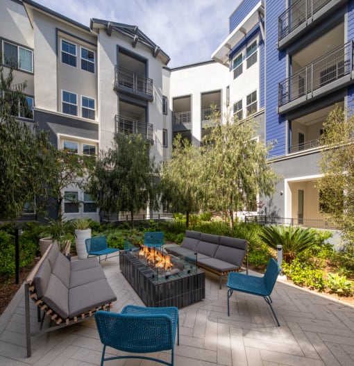 an outdoor patio with a firepit and lounge chairs at Citron, California