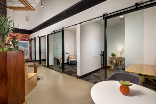 a room with white walls and glass doors at Citron, Anaheim, CA
