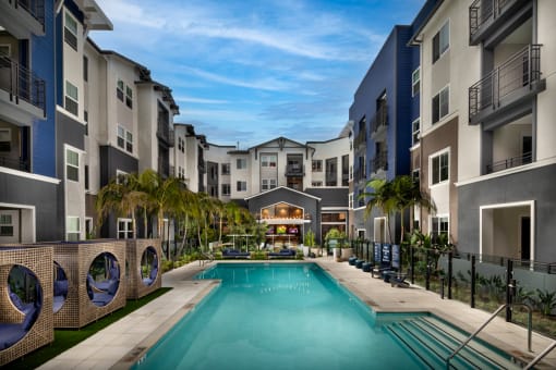 a swimming pool in the middle of an apartment complex at Citron, Anaheim, CA