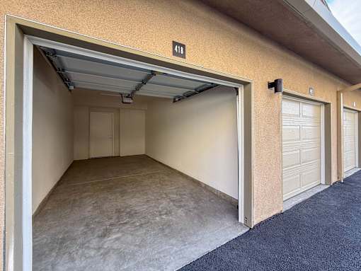 A garage with a number 418 on the wall.