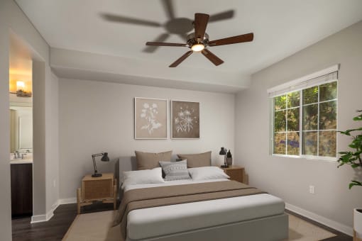 Bedroom with a large bed and a ceiling fan  at Lakeview 88, Spring Valley, California