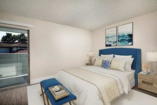 A bedroom with a bed, nightstand, and window.
