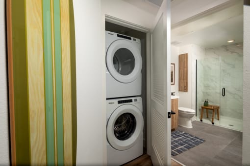 a front loading washer and dryer in a laundry room