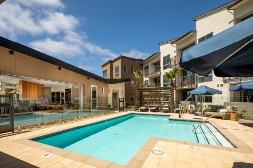 our apartments have a swimming pool and a patio with umbrellas