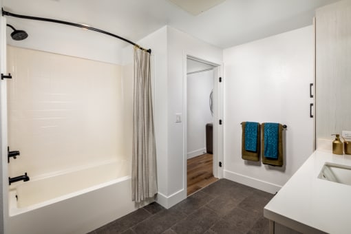 a bathroom with a shower and a sink at VORA LUX, San Diego