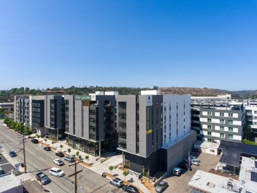 an aerial view of a city with several tall buildings and a parking lot at VORA LUX, California, 92120
