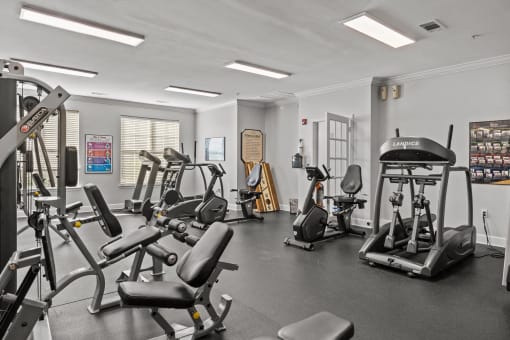 a gym with treadmills and other exercise equipment in a building