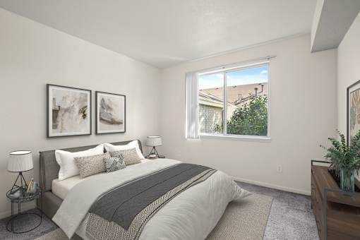 A bedroom with a large bed and two framed pictures on the wall.