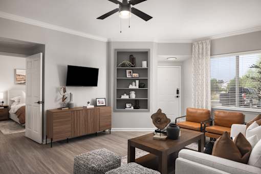 A modern living room with a brown leather couch and a wooden coffee table.