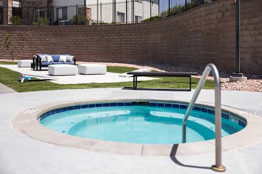 A small round pool with a metal ladder.