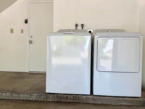 A washer and dryer in a garage.