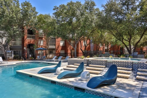 our apartments showcase an unique swimming pool at The Quarry Alamo Heights, San Antonio, TX, 78209