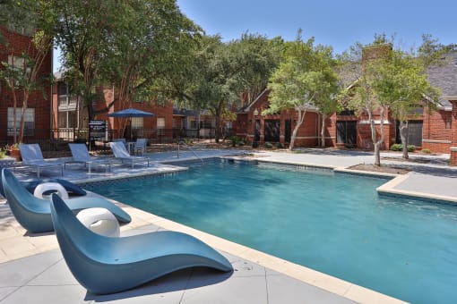 this is a photo of the pool area at harvard square apartments in dallas, tx at The Quarry Alamo Heights, San Antonio, TX