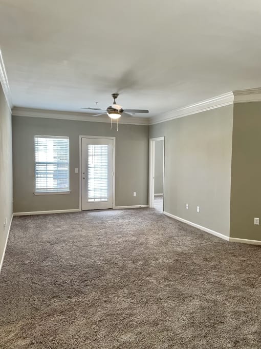spacious living room with patio access