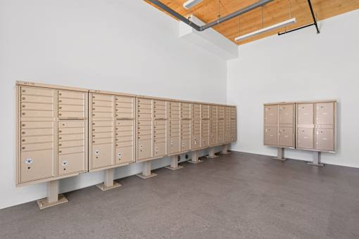 A row of lockers are lined up in a room.