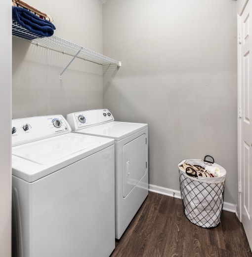 Laundry room area with storage