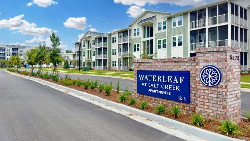 an apartment building with a sign that reads waterleaf apartments