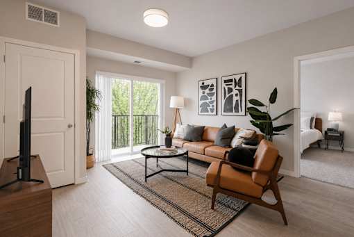 A living room with a brown leather chair and a coffee table.