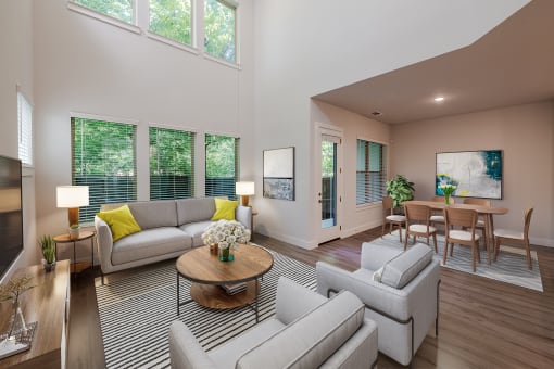 a living room with couches and chairs and a table