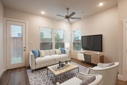 a living room with a couch and a tv