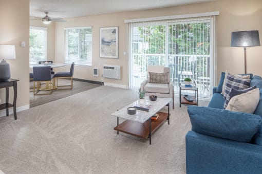 Living room with a couch and a coffee table at Summerfield, Tigard, OR