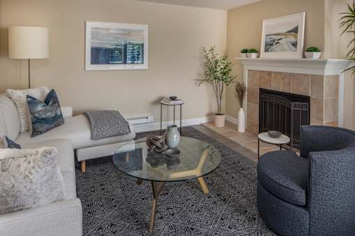 a living room with a fireplace and couches