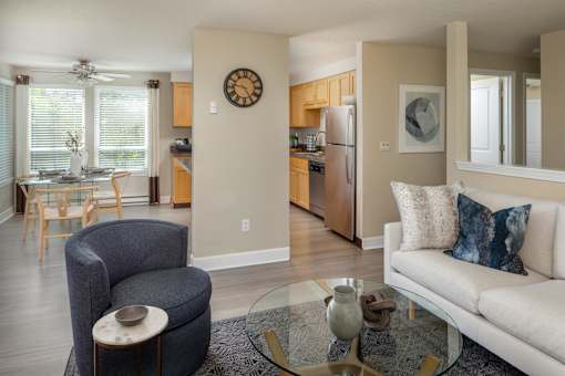 a living room with a couch and a glass table