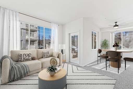 A living room with a grey sofa and a coffee table.