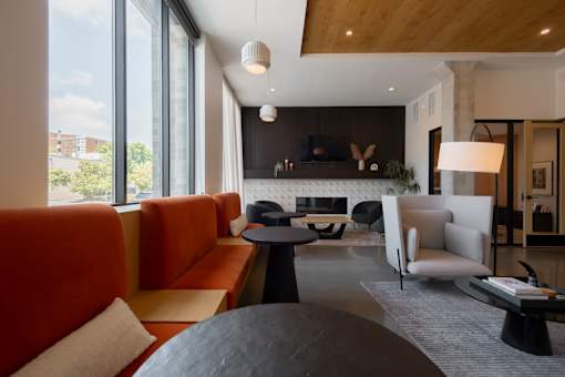 A modern living room with a red sofa and a black coffee table.