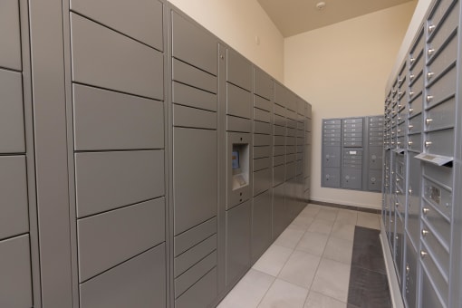 a row of lockers in a room with a bunch of doors at Element 12 Apartments, Henderson NV