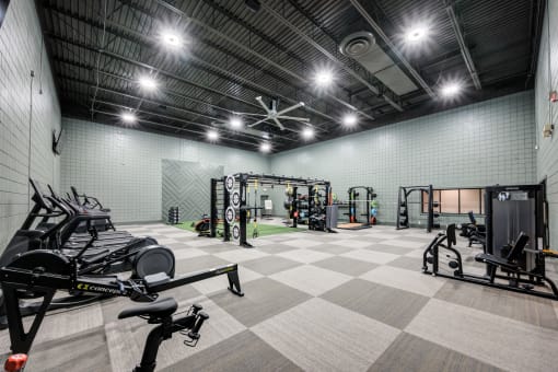 the gym at the legend at park ridge apartments