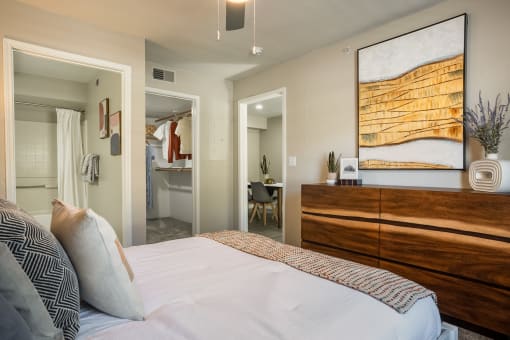 a bedroom with a bed and a dresser at Odyssey Ridge, Albuquerque, NM, 87114