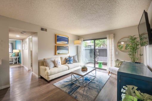 a living room with a couch and a table