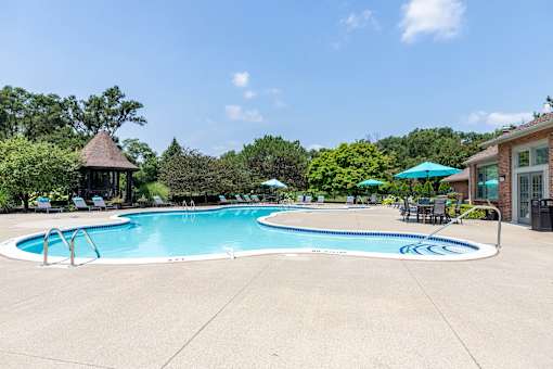 A large swimming pool with a blue logo in the middle.
