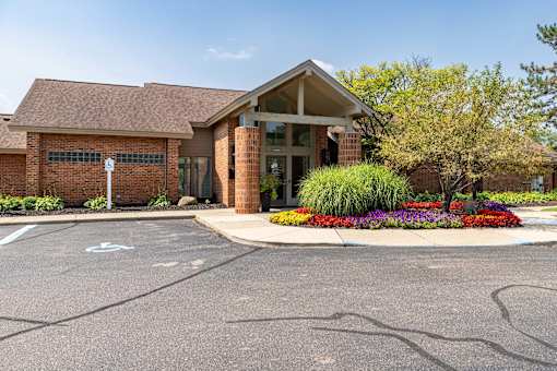 A building with a parking lot in front of it.