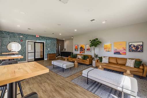Living Room With Chairs and a Table at Odyssey Apartments, Albuquerque, NM