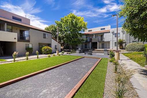 Yard of a House With a Sidewalk at Odyssey Apartments, Albuquerque, NM