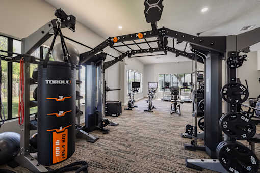 A Gym With Weights at Odyssey Apartments, Albuquerque, New Mexico