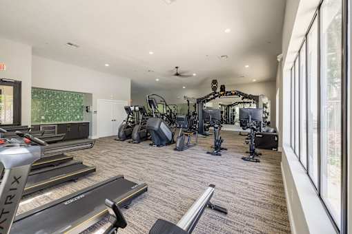 A Gym With Treadmills at Odyssey Apartments, New Mexico